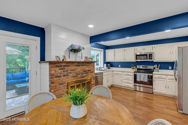 a kitchen with a stove top oven and sink