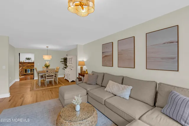 a living room with furniture or couch and a dining table