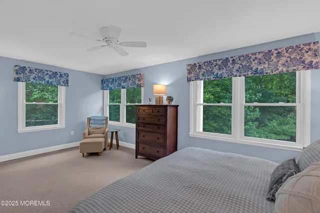 a bed room with a bed and a chair