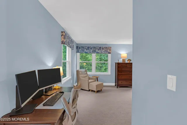 a workspace with furniture and a window