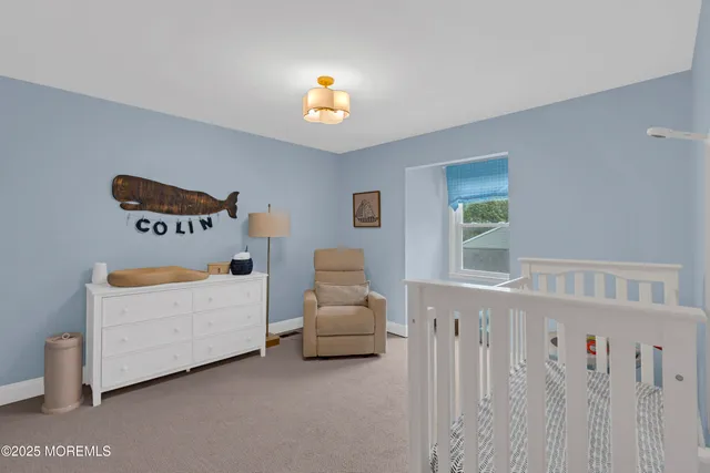 a bedroom with a bed and a book shelf