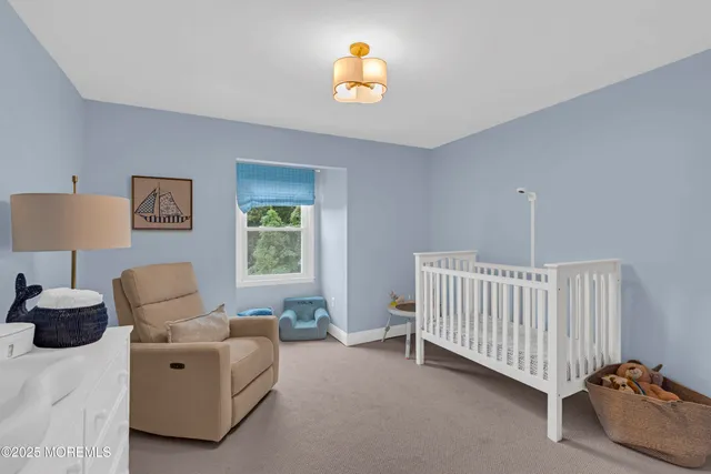 a bathroom with a sink a toilet a mirror and shower