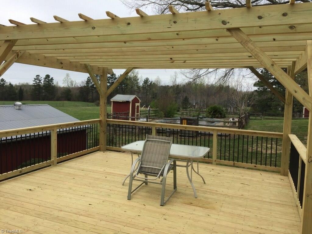 6550 Hunt Road Pleasant Garden, NC 27313 - Photo 17 of 26 Deck overlooks pool. Pergola is a beautiful addition for those sunny days.