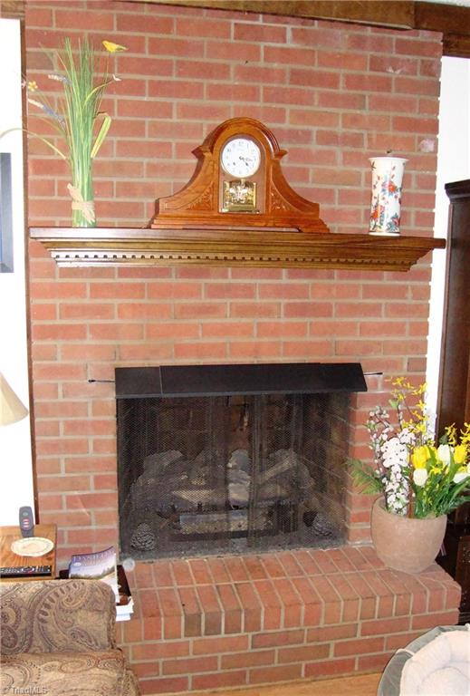 6550 Hunt Road Pleasant Garden, NC 27313 - Photo 10 of 26 Masonry fireplace with gas logs