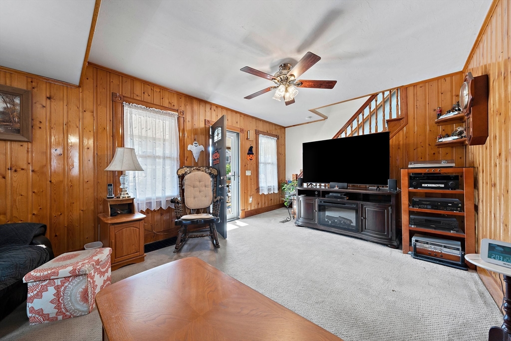 14 Vanness Road Weymouth, MA 02191 - Photo 13 of 27 a living room with furniture and a flat screen tv