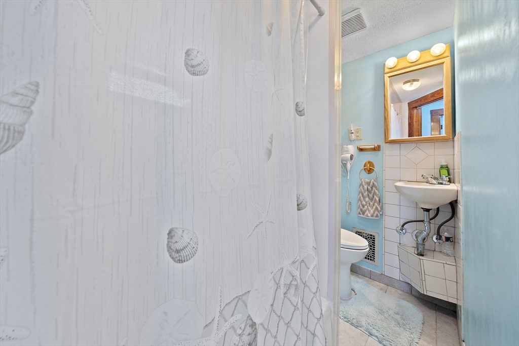 14 Vanness Road Weymouth, MA 02191 - Photo 19 of 27 a bathroom with a sink toilet and shower
