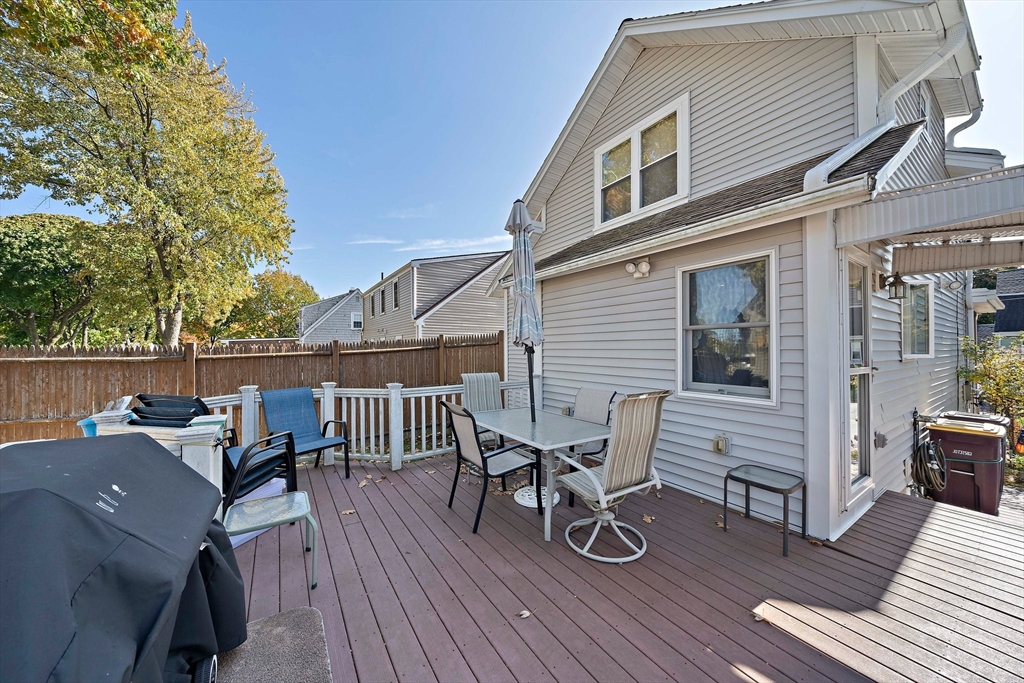 14 Vanness Road Weymouth, MA 02191 - Photo 26 of 27 a roof deck with table and chairs wooden floor and fence