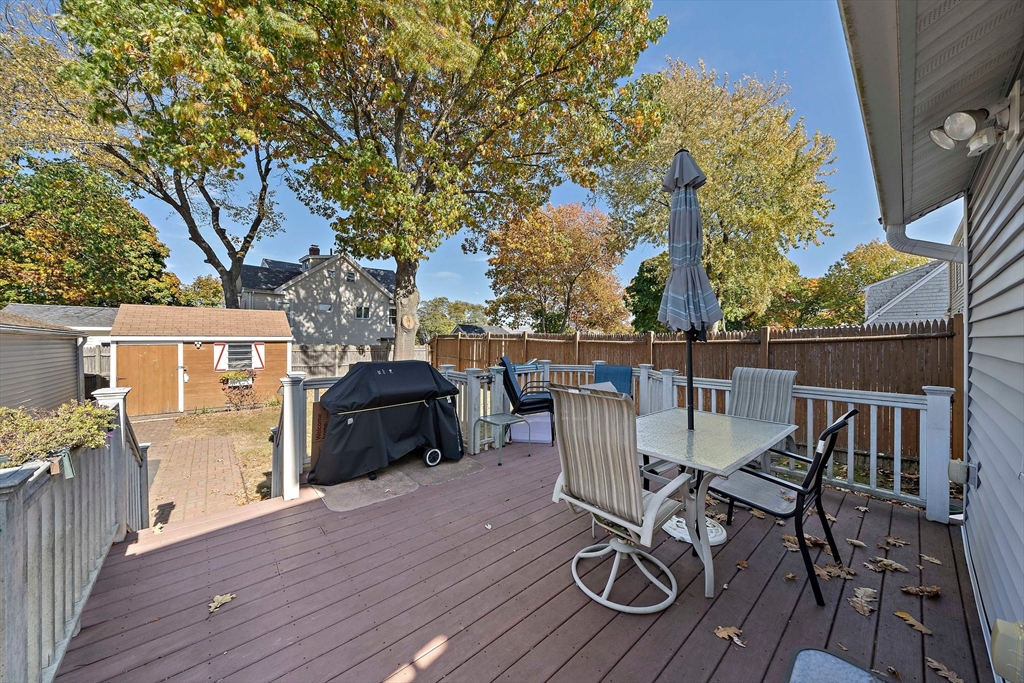 14 Vanness Road Weymouth, MA 02191 - Photo 27 of 27 a view of a patio with table and chairs with wooden floor and fence