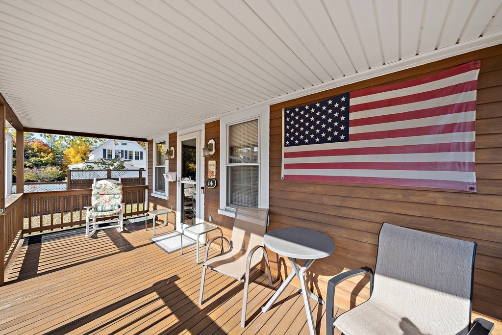 14 Vanness Road Weymouth, MA 02191 - Photo 5 of 27 a view of a patio with table and chairs with wooden floor