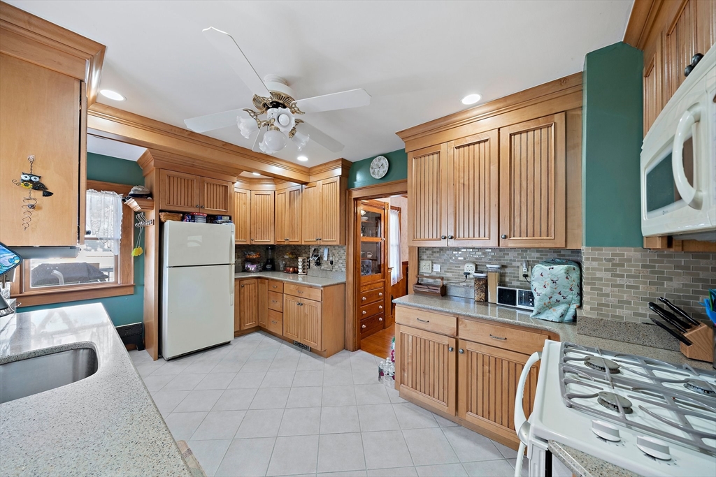 14 Vanness Road Weymouth, MA 02191 - Photo 7 of 27 a kitchen with refrigerator cabinets and furniture