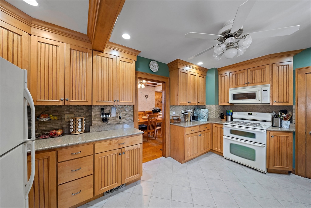 14 Vanness Road Weymouth, MA 02191 - Photo 10 of 27 a kitchen with a stove a sink and cabinets