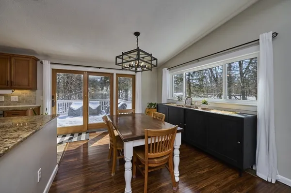a dining room with furniture window wooden floor
