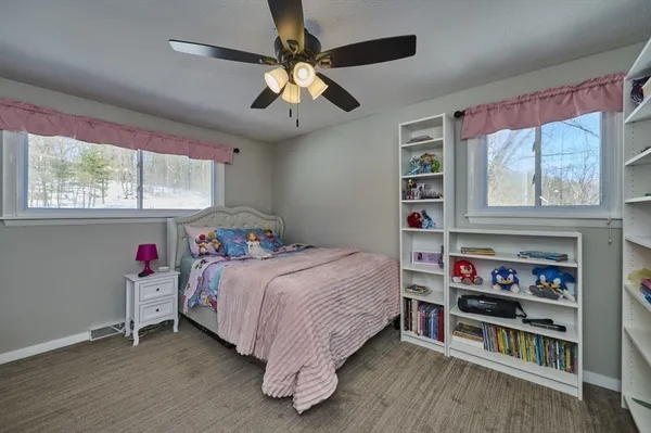 a bedroom with a bed furniture and a window