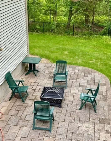a view of a backyard with sitting area