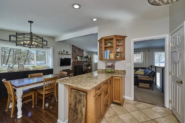 a kitchen that has a lot of cabinets in it