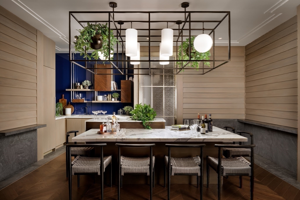 40 Trinity Place, Unit PH35A Boston, MA 02116 - Photo 14 of 22 a view of a dining room with furniture and chandelier