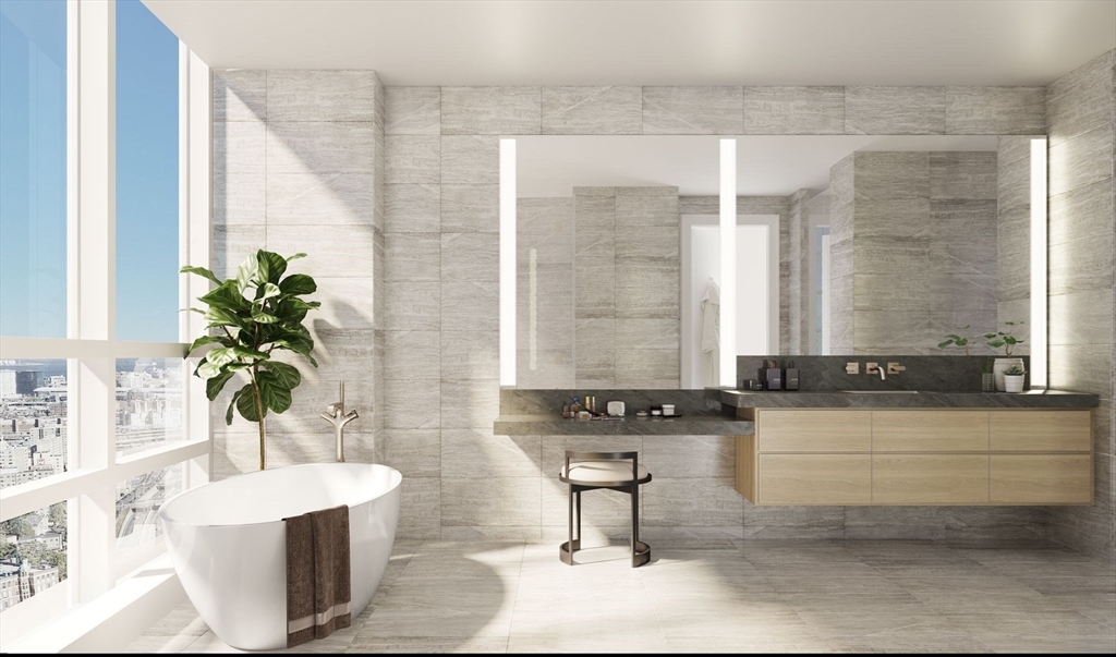 40 Trinity Place, Unit PH35A Boston, MA 02116 - Photo 2 of 22 a bath room with a sink and a mirror