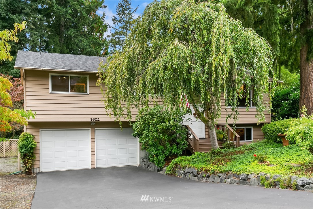 24022 7th Avenue West Bothell, WA 98021 - Photo 1 of 26 a front view of a house with a yard
