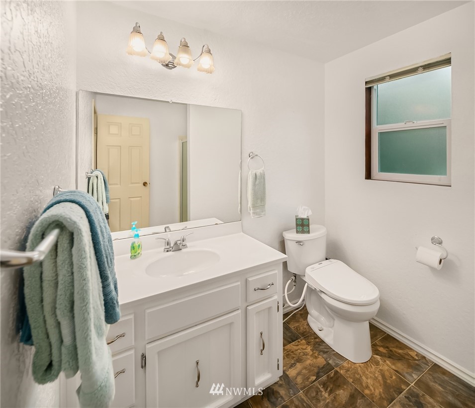 24022 7th Avenue West Bothell, WA 98021 - Photo 11 of 26 a bathroom with a sink toilet and a mirror
