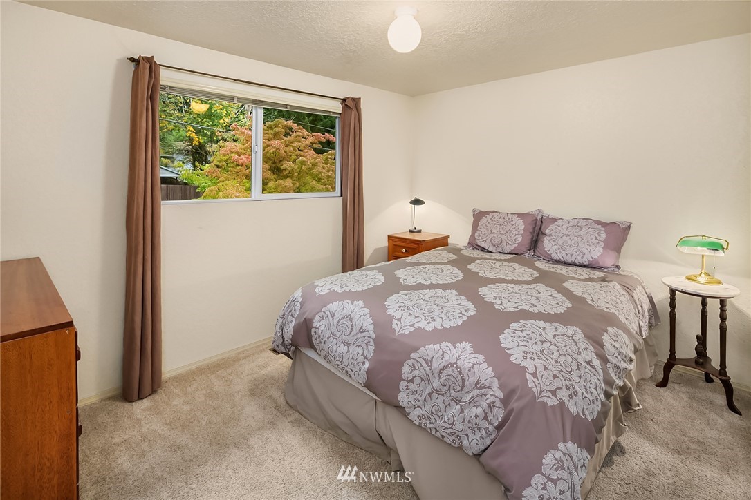 24022 7th Avenue West Bothell, WA 98021 - Photo 12 of 26 a bedroom with a bed and a window