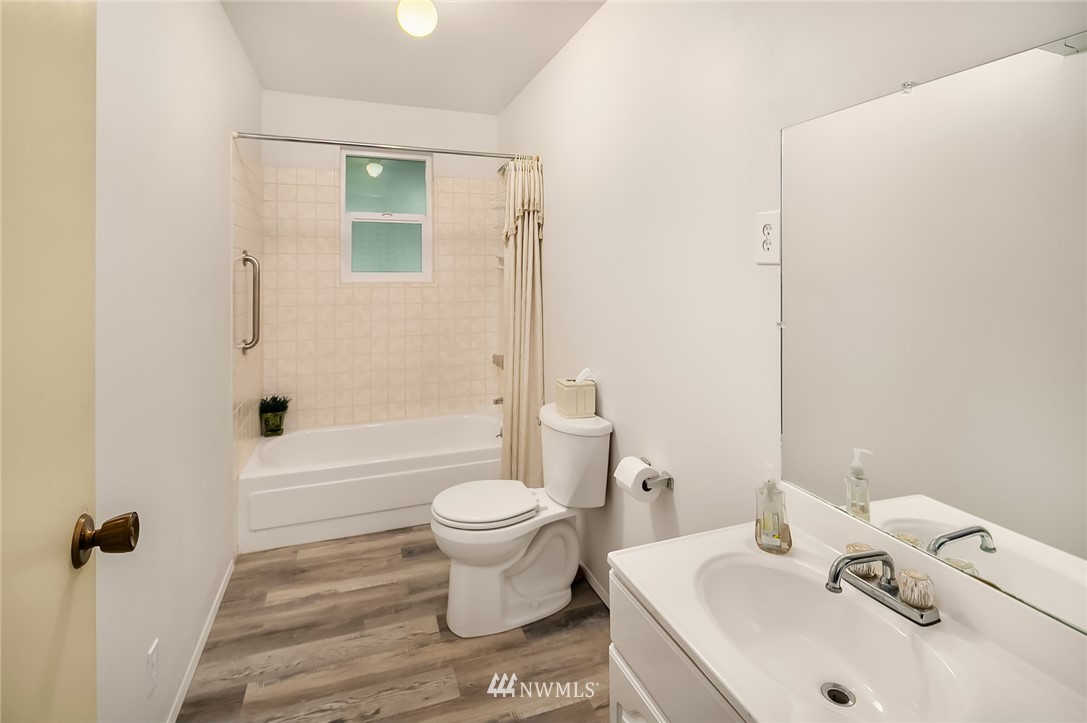 24022 7th Avenue West Bothell, WA 98021 - Photo 17 of 26 a bathroom with a sink toilet and shower