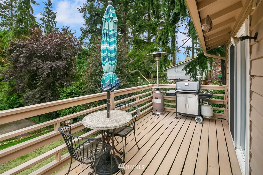24022 7th Avenue West Bothell, WA 98021 - Photo 19 of 26 a view of balcony with chairs and wooden fence