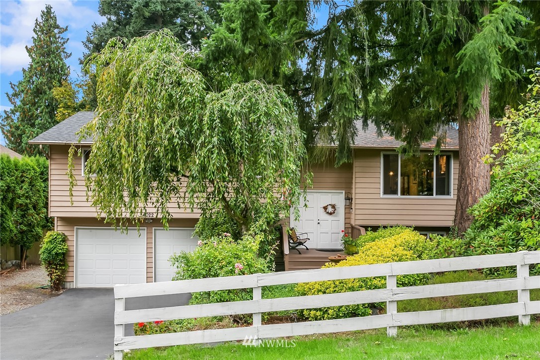24022 7th Avenue West Bothell, WA 98021 - Photo 3 of 26 a front view of a house with a garden