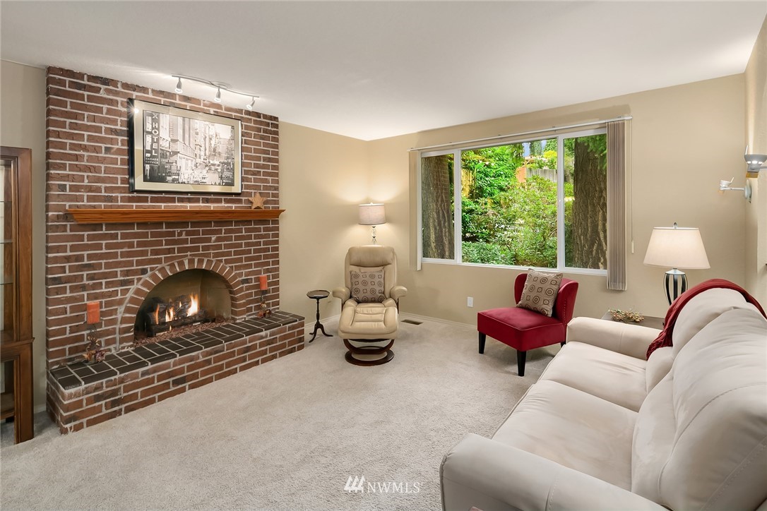 24022 7th Avenue West Bothell, WA 98021 - Photo 5 of 26 a living room with furniture and a fireplace