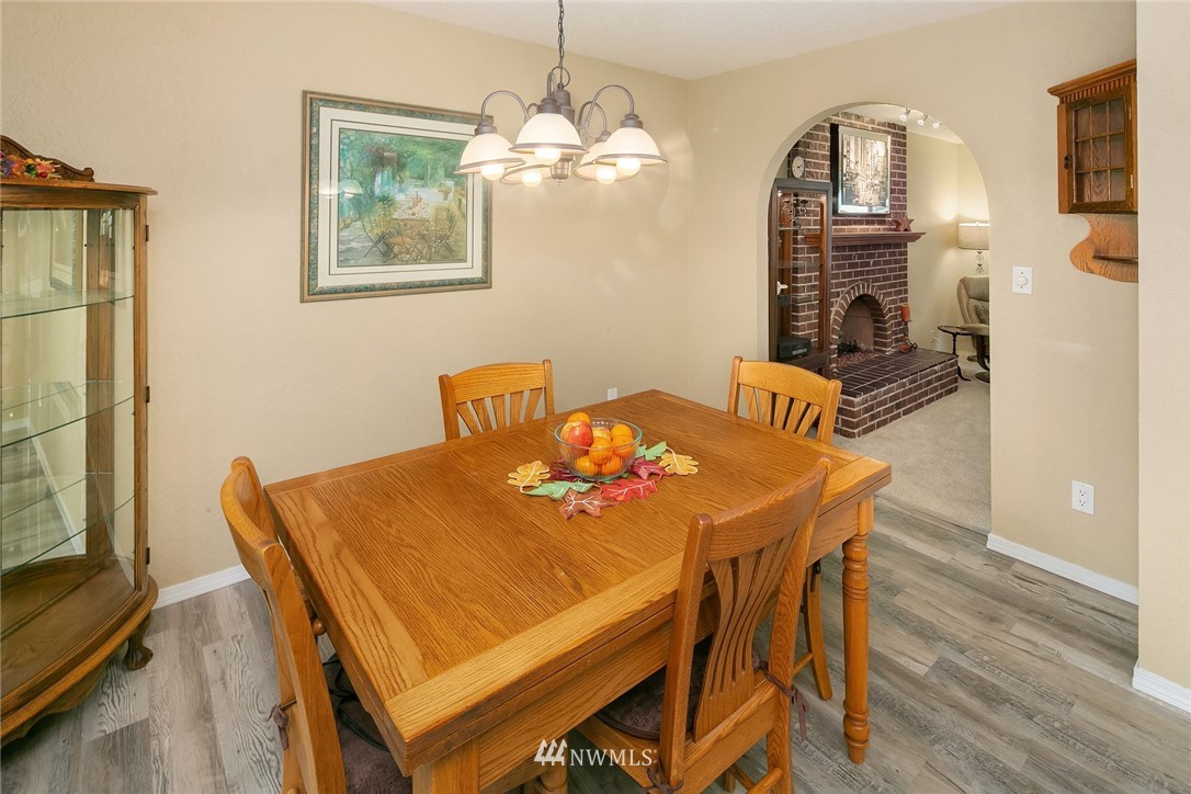 24022 7th Avenue West Bothell, WA 98021 - Photo 9 of 26 a view of a dining room with furniture and wooden floor