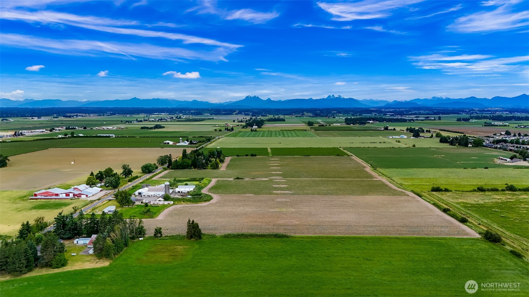 8634 Double Ditch Road Lynden, WA 98264 - Photo 27 of 40 a view of a lake with a houses in the background