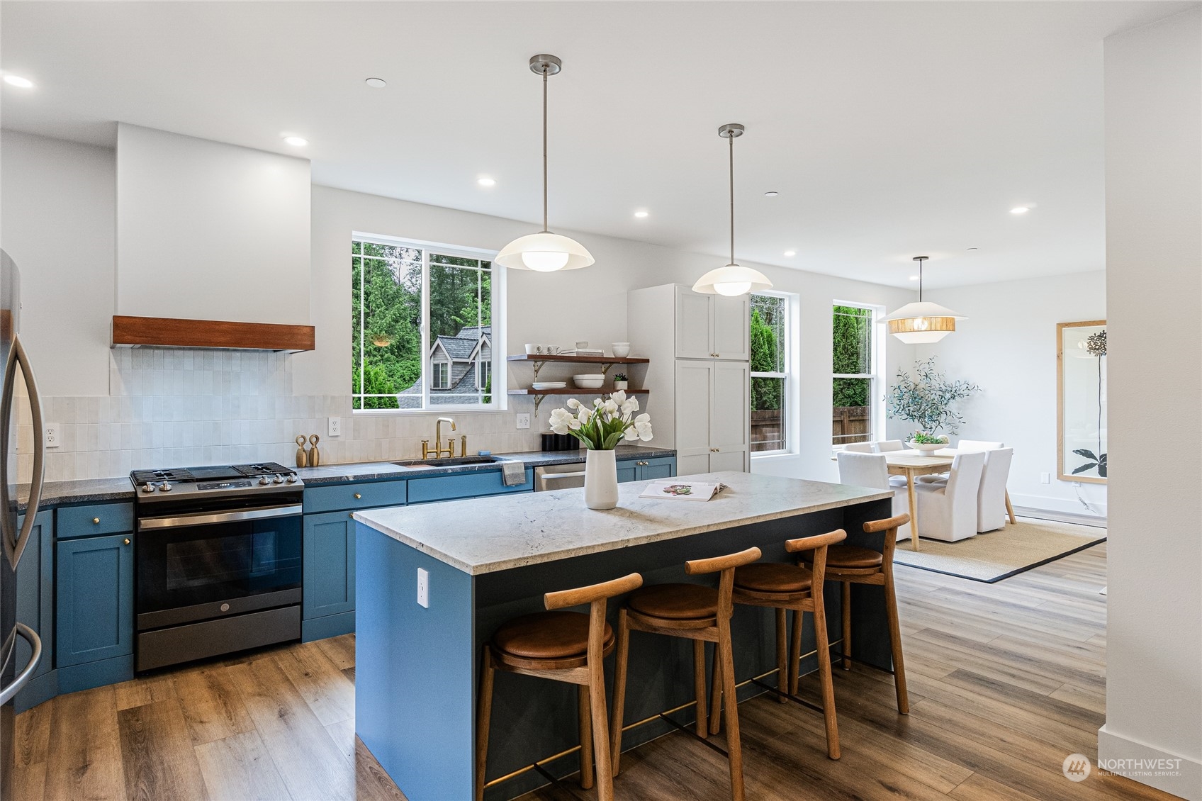 24310 13th Place West Bothell, WA 98021 - Photo 18 of 35 a kitchen that has a table and chairs in it