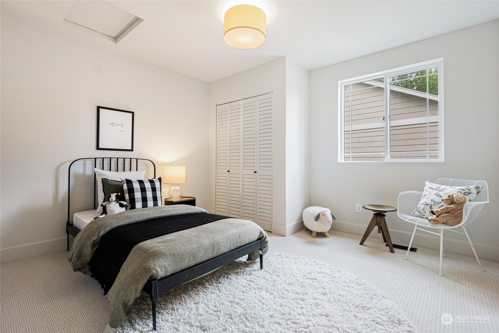 24310 13th Place West Bothell, WA 98021 - Photo 22 of 35 a bedroom with a bed and a window