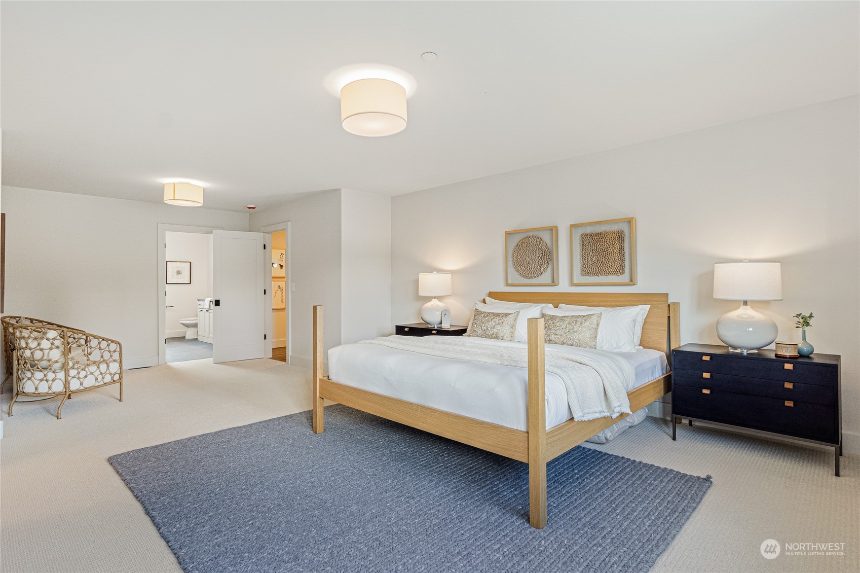 24310 13th Place West Bothell, WA 98021 - Photo 28 of 35 a bedroom with a bed and a lamp