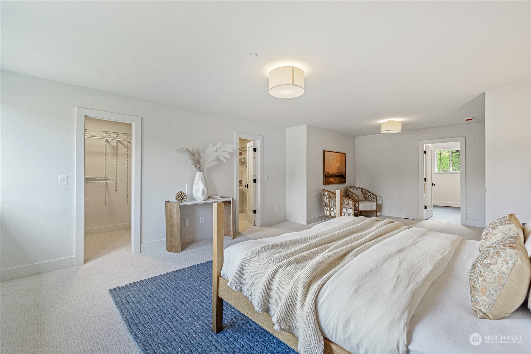 24310 13th Place West Bothell, WA 98021 - Photo 30 of 35 a bedroom with a bed and wooden floor