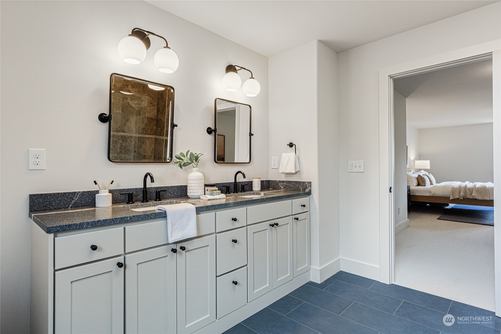 24310 13th Place West Bothell, WA 98021 - Photo 32 of 35 a en suite bathroom with double sink and a mirror