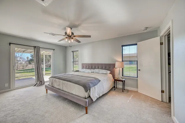 a bedroom with a flat screen television and a bed