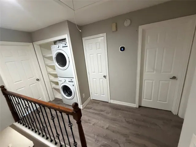 a view of a hallway with washer and dryer