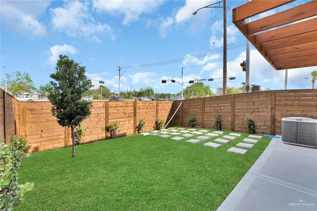 a view of yard with swimming pool