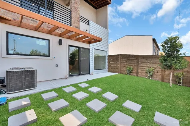 a view of yard with front door and porch