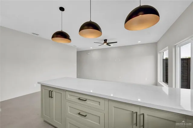 a kitchen with a table and a stove