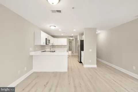 a view of kitchen with wooden floor