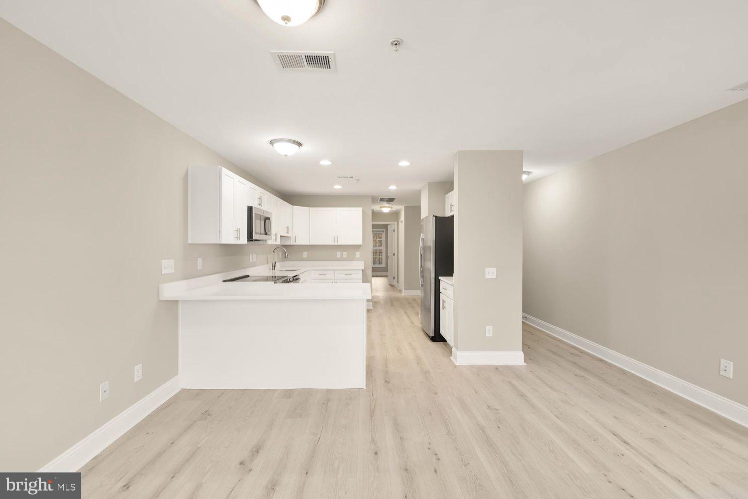 1753 W Street Southeast, Unit C Washington, DC 20020 - Photo 15 of 29 a view of kitchen with wooden floor
