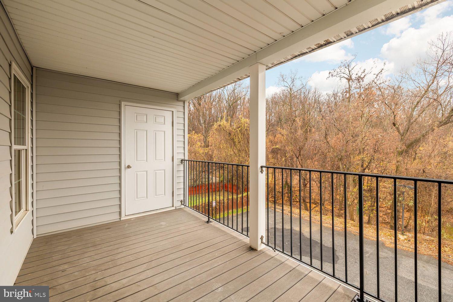 1753 W Street Southeast, Unit C Washington, DC 20020 - Photo 26 of 29 a view of a balcony with wooden floor