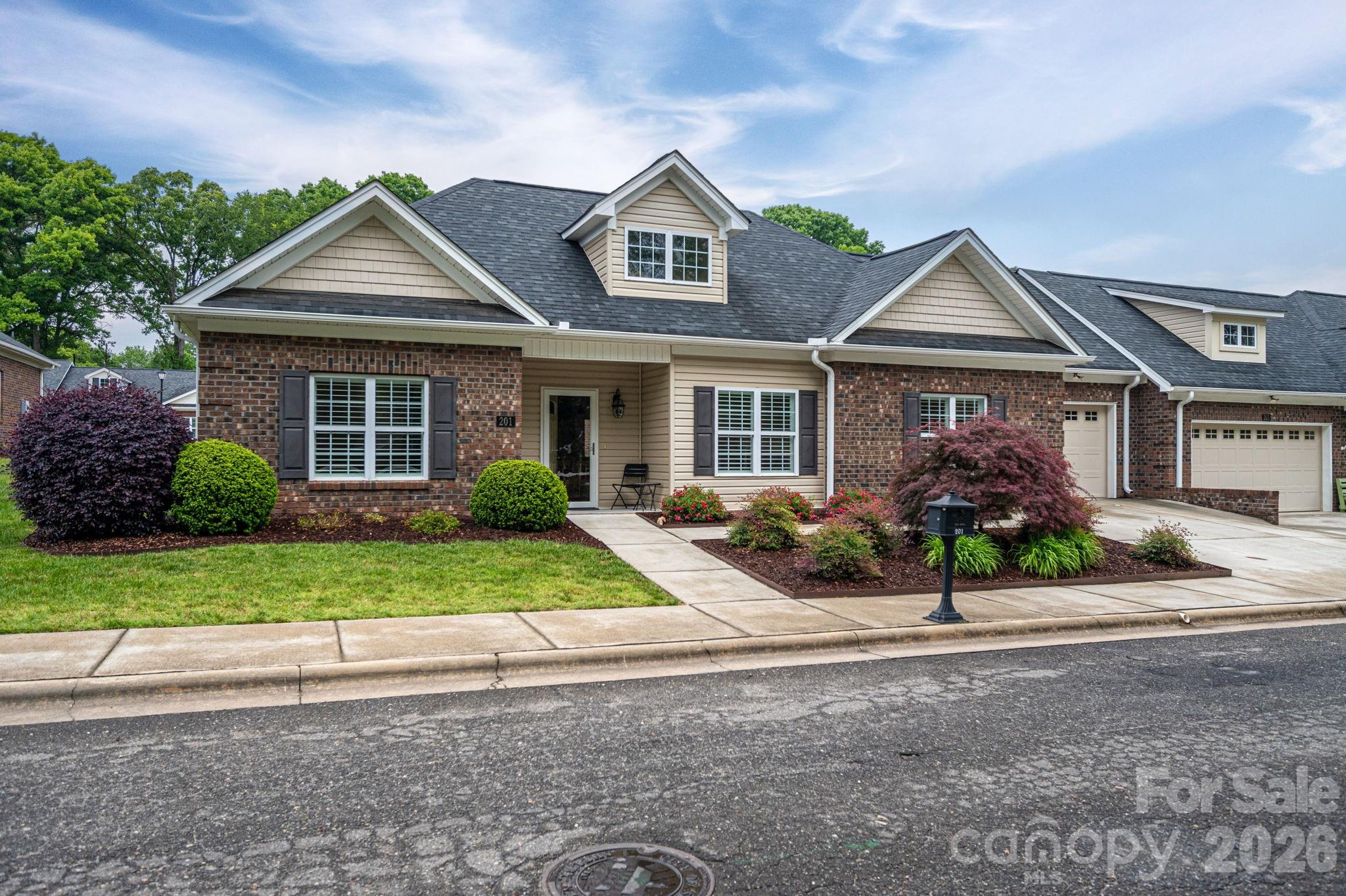 201-t R T R Harris Drive Shelby, NC 28150 - Photo 1 of 25 a front view of a house with a yard and garage