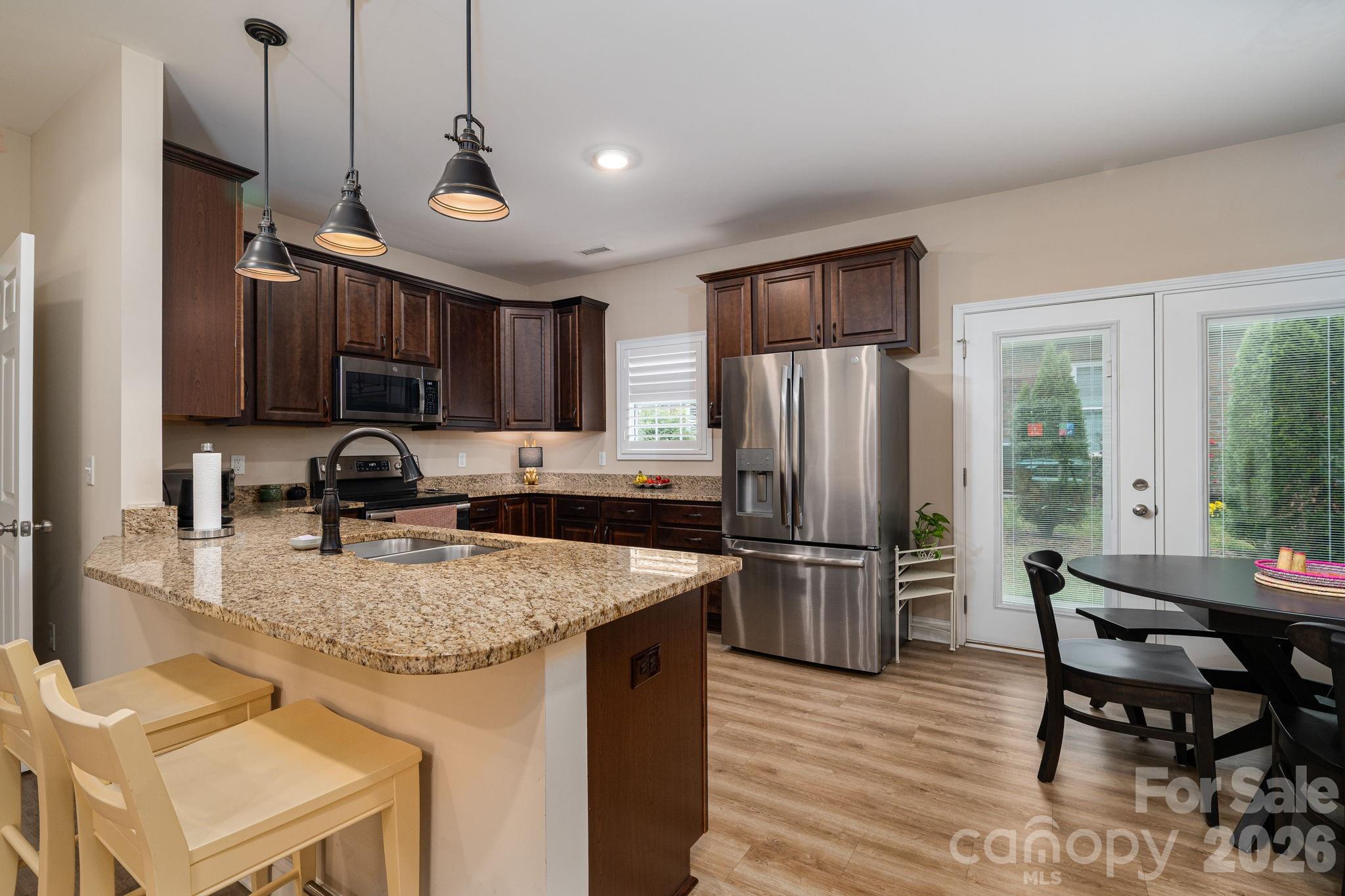 201-t R T R Harris Drive Shelby, NC 28150 - Photo 12 of 25 a kitchen with refrigerator and chairs