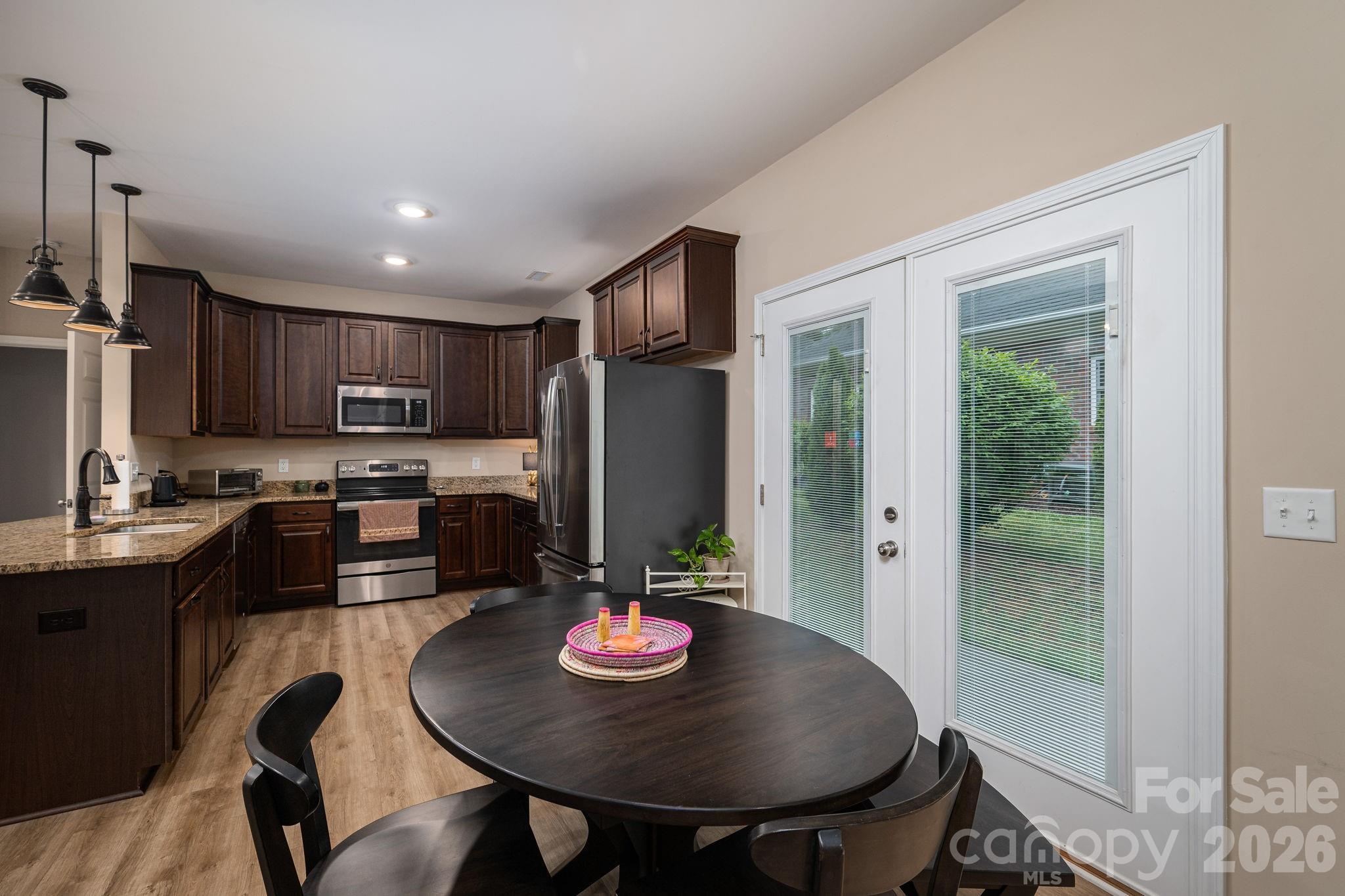 201-t R T R Harris Drive Shelby, NC 28150 - Photo 14 of 25 a kitchen with refrigerator a sink and chairs