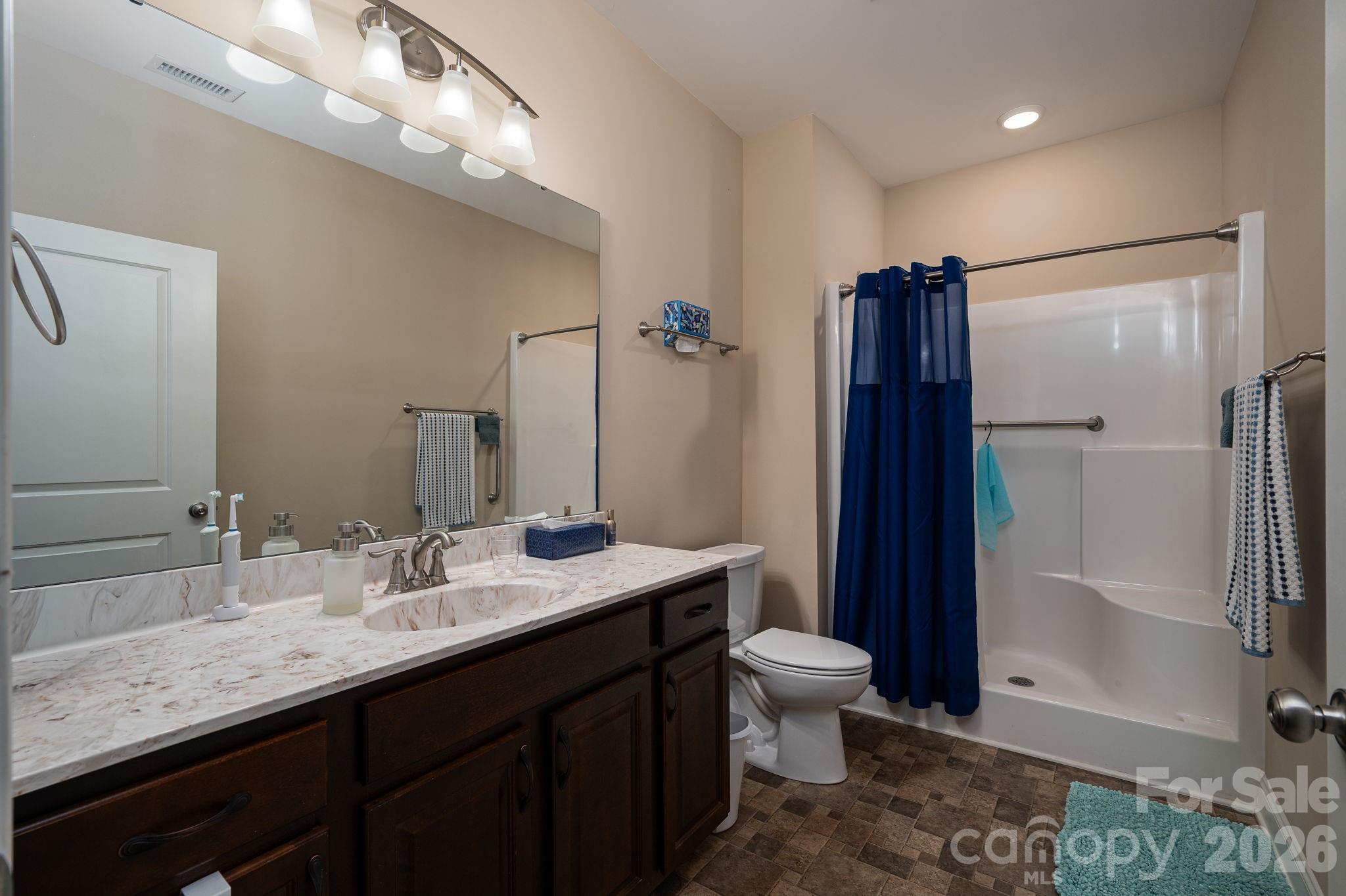 201-t R T R Harris Drive Shelby, NC 28150 - Photo 18 of 25 a bathroom with a double vanity sink toilet and shower