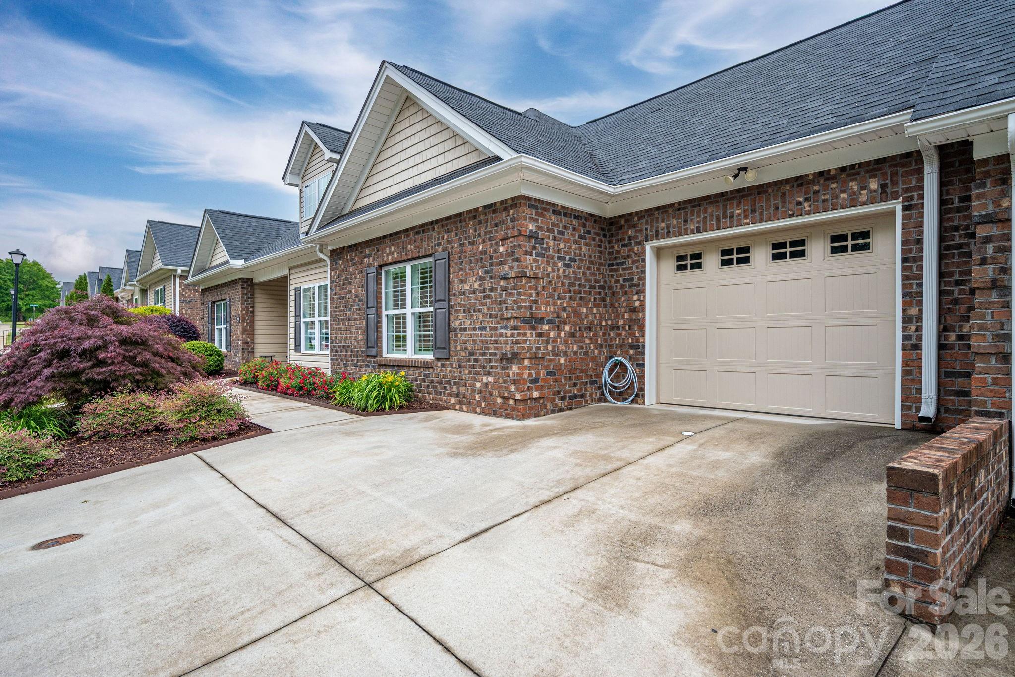 201-t R T R Harris Drive Shelby, NC 28150 - Photo 2 of 25 a front view of a house with a yard and garage