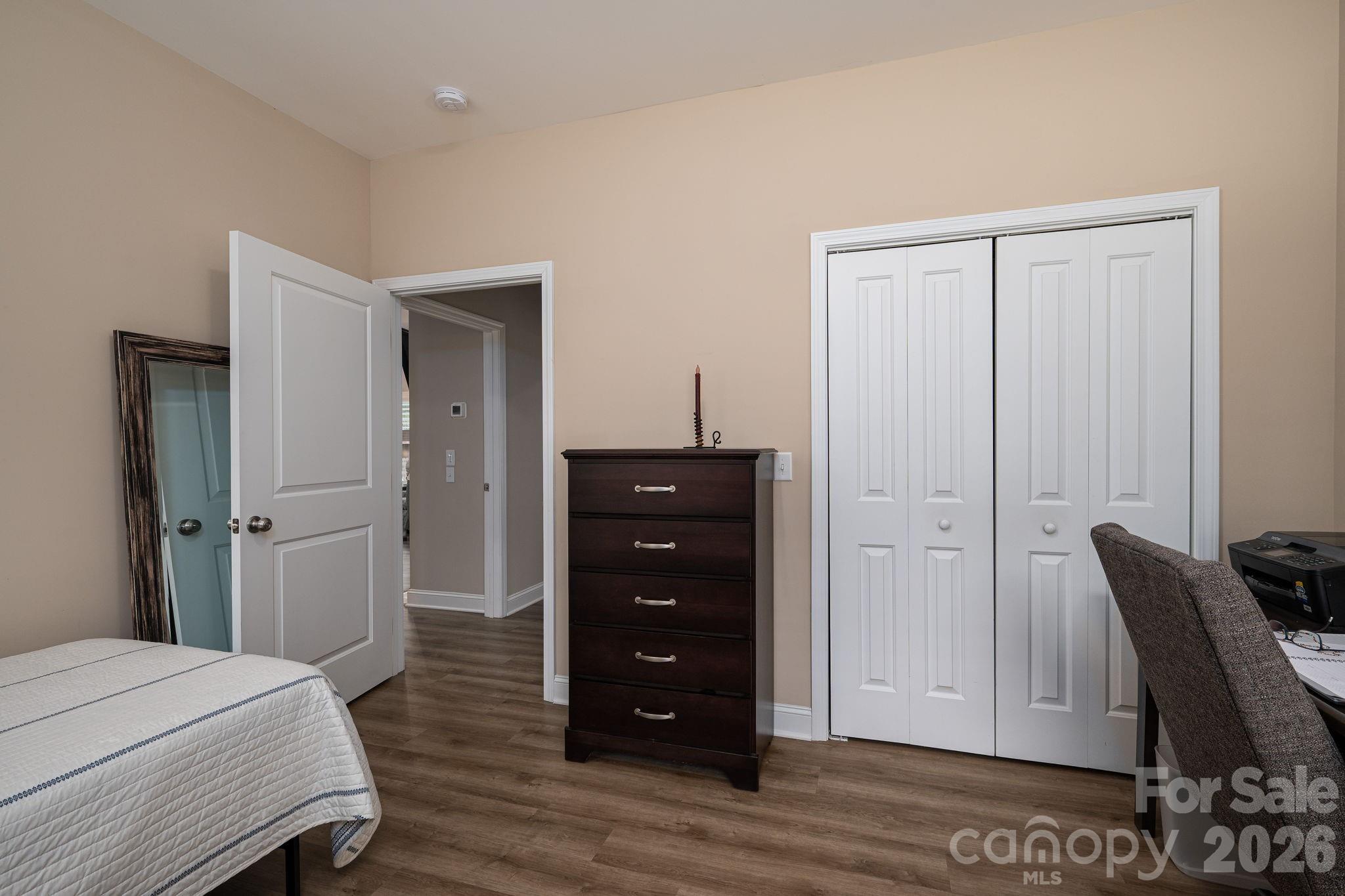 201-t R T R Harris Drive Shelby, NC 28150 - Photo 21 of 25 a bedroom with a bed and wooden floor