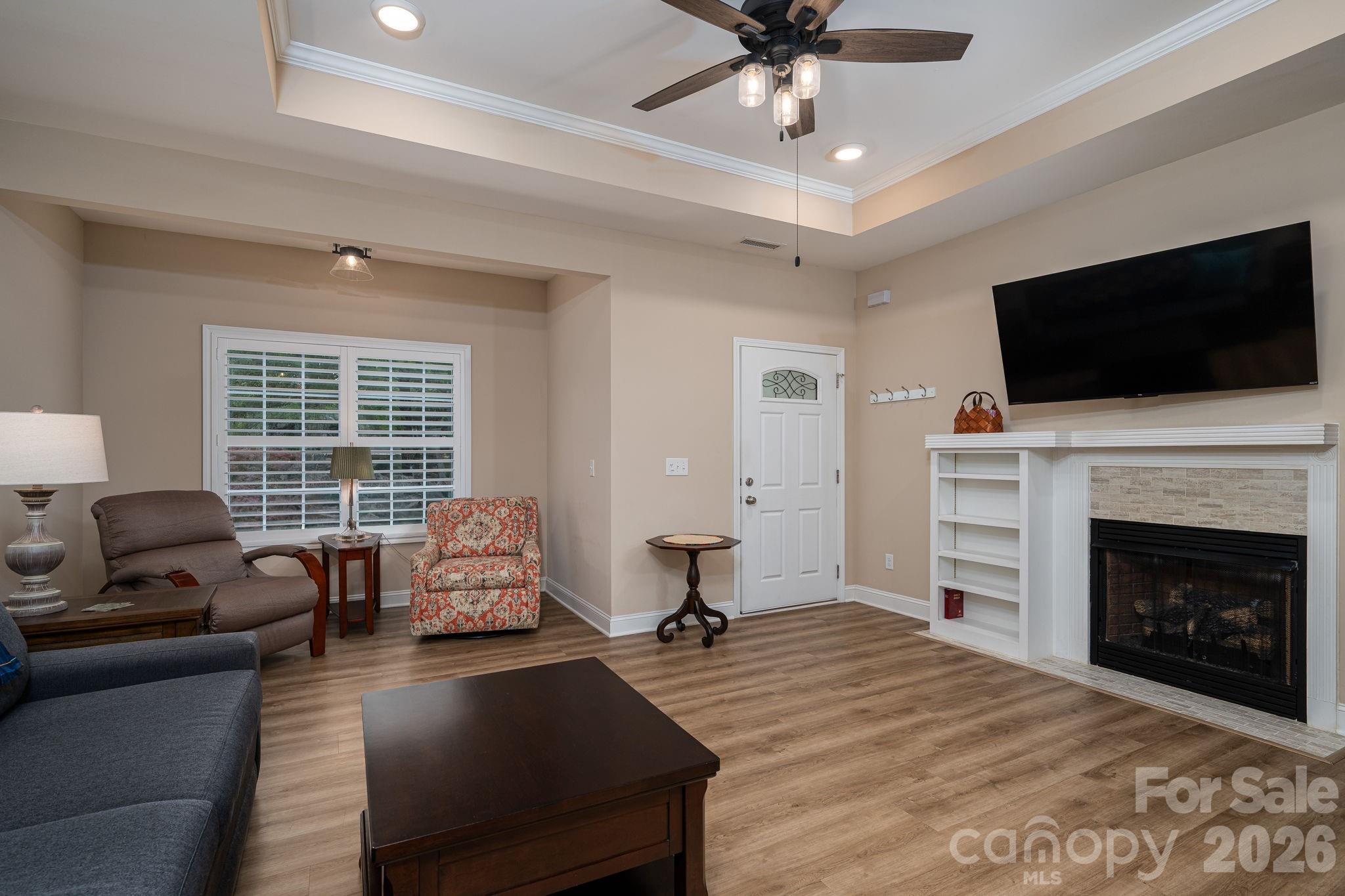 201-t R T R Harris Drive Shelby, NC 28150 - Photo 9 of 25 a living room with furniture a fireplace and a flat screen tv